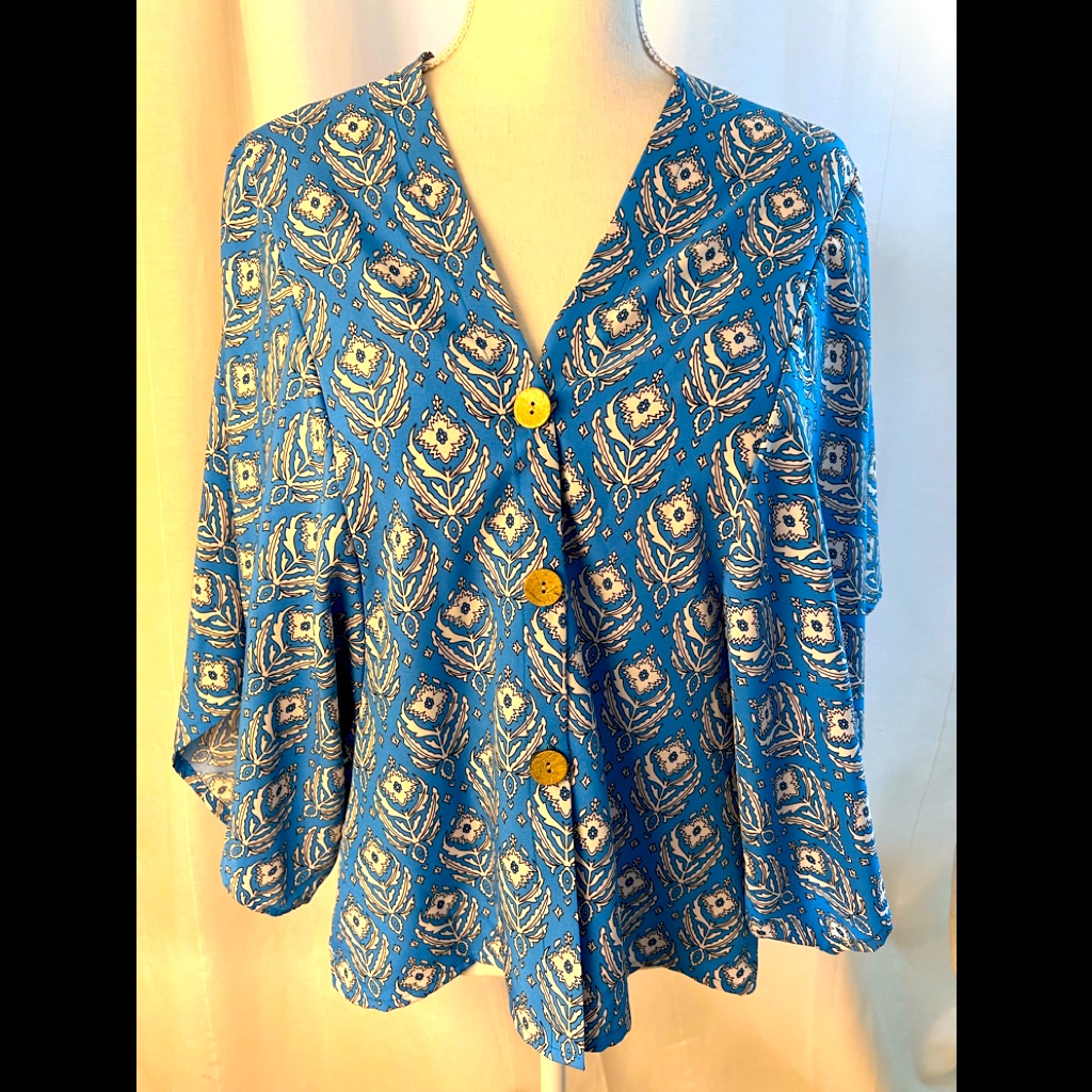 Specially Designed Blouse In Flattering Color With Cape Type Sleeves Os